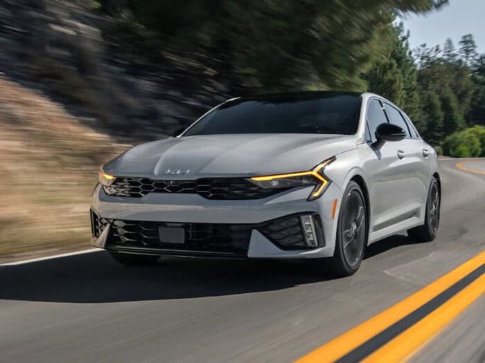 2026 Kia K5 AWD front driving on the road