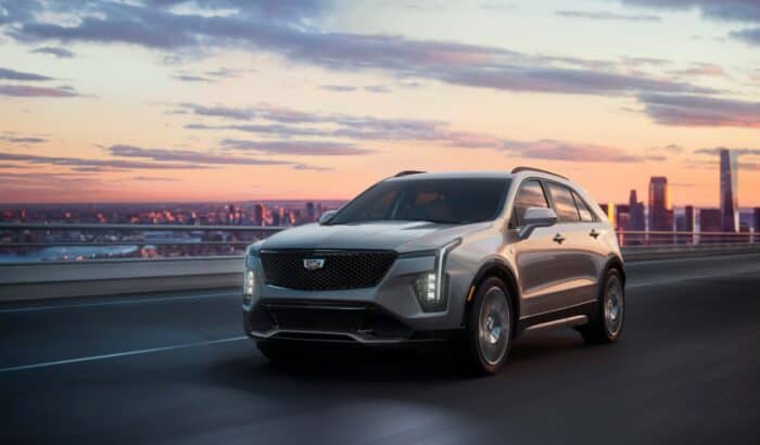 2024 Cadillac XT4 in silver parked outside at sunset