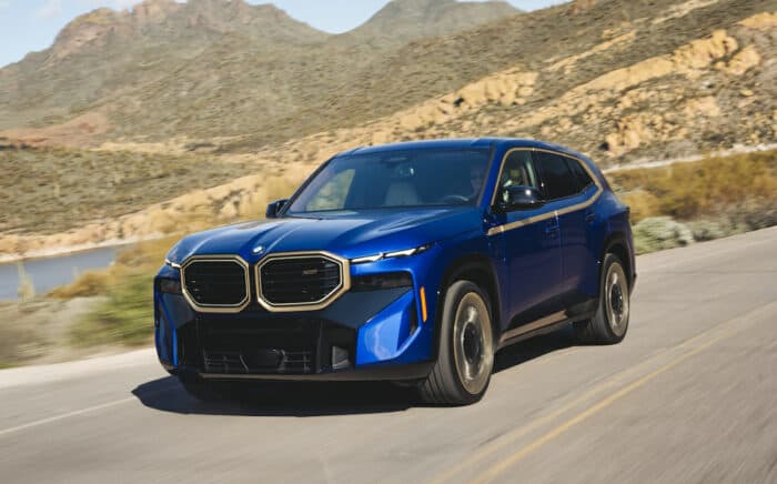 2023 BMW XM in blue driving in the desert