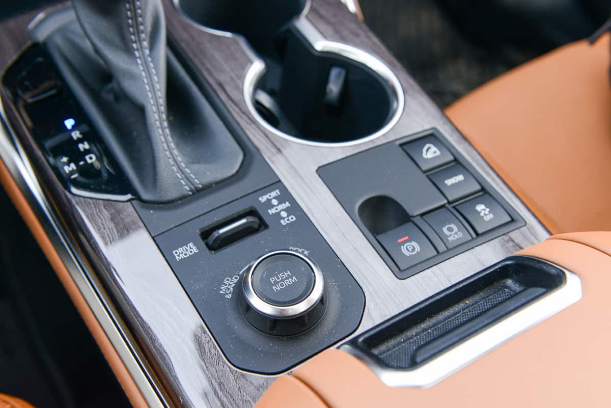 2023 Toyota Highlander Platinum / Limited AWD interior centre console controls including drive mode buttons, e park button, and more
