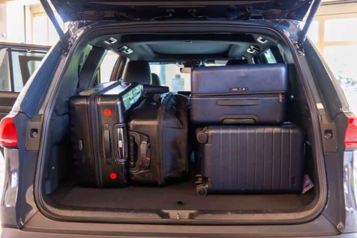 2024 Toyota Grand Highlander interior showing luggage in the back with the 3rd row down