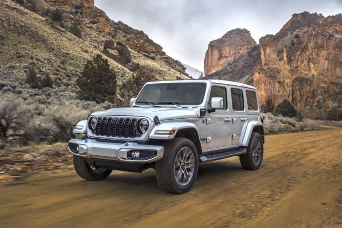 2024 Jeep Wrangler High Altitude 4xe front view driving in Utah