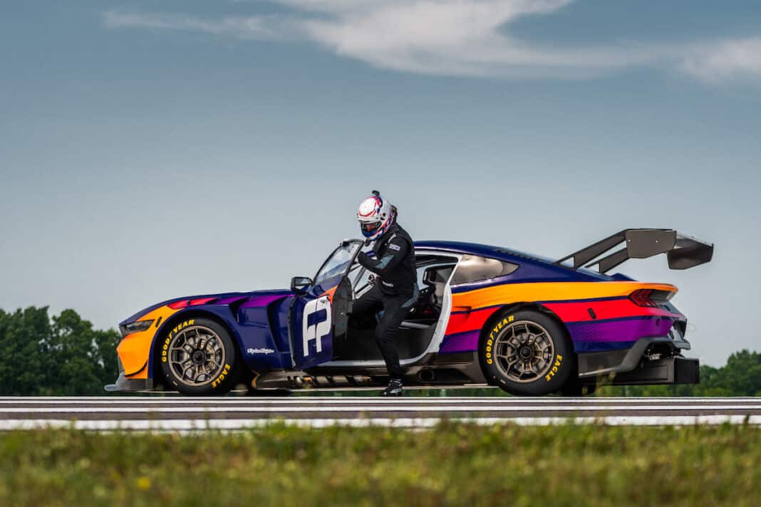 Ford Mustang GT3 race car side view with driver