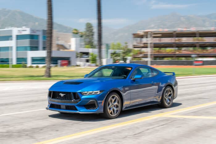  2024 Mustang GT in blue driving down the road in LA, California
