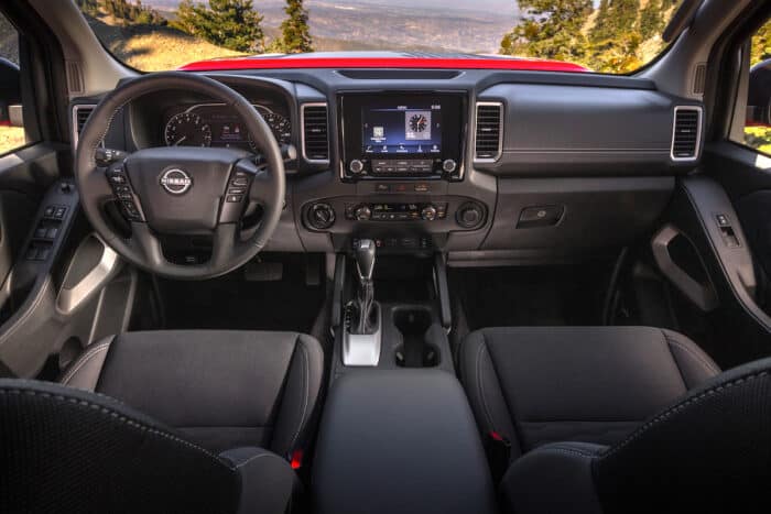 2024 Nissan Frontier Hardbody Edition interior front cabin view from the back seats