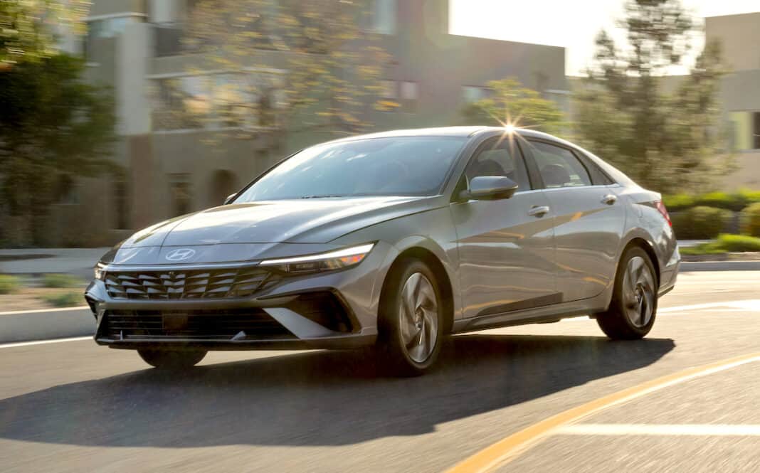 2024 Hyundai Elantra driving on the street front view