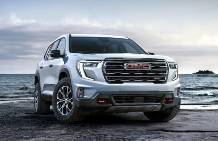 2024 GMC Acadia AT4 front view parked outside by water