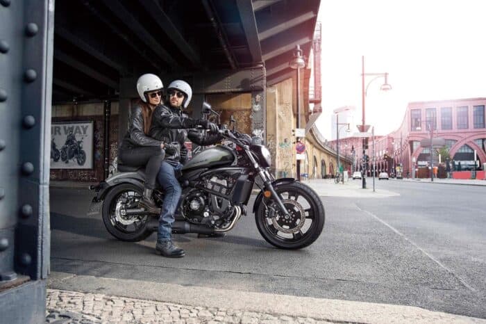 2026 Kawasaki Vulcan S on road with rider and passenger