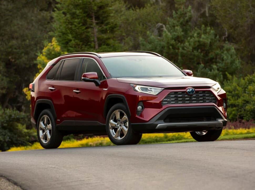 2019 Toyota RAV4 Limited Hybrid in ruby flare pearl parked outside