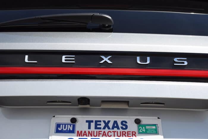 2024 Lexus TX F Sport close up of Lexus wording on rear above red strip light