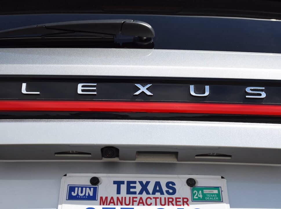 2024 Lexus TX F Sport close up of Lexus wording on rear above red strip light