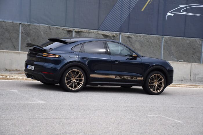 2024 Porsche Cayenne Turbo E Hybrid in blue rear view parked on the street