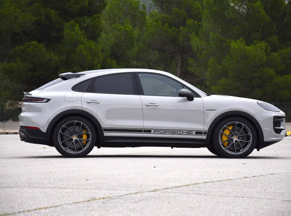 2024 Porsche Cayenne Turbo E Hybrid in white side view parked on street by trees