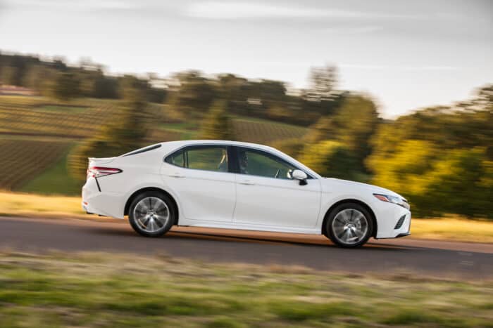 2018 Toyota Camry Hybrid SE side view driving fast