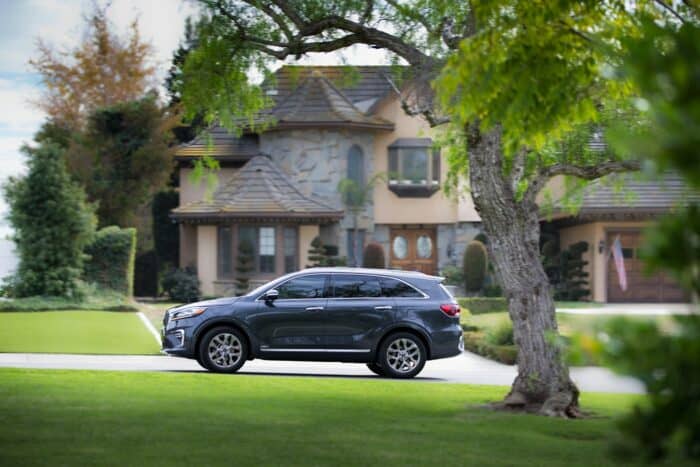 2019 Kia Sorento SXL V6 driving past a house