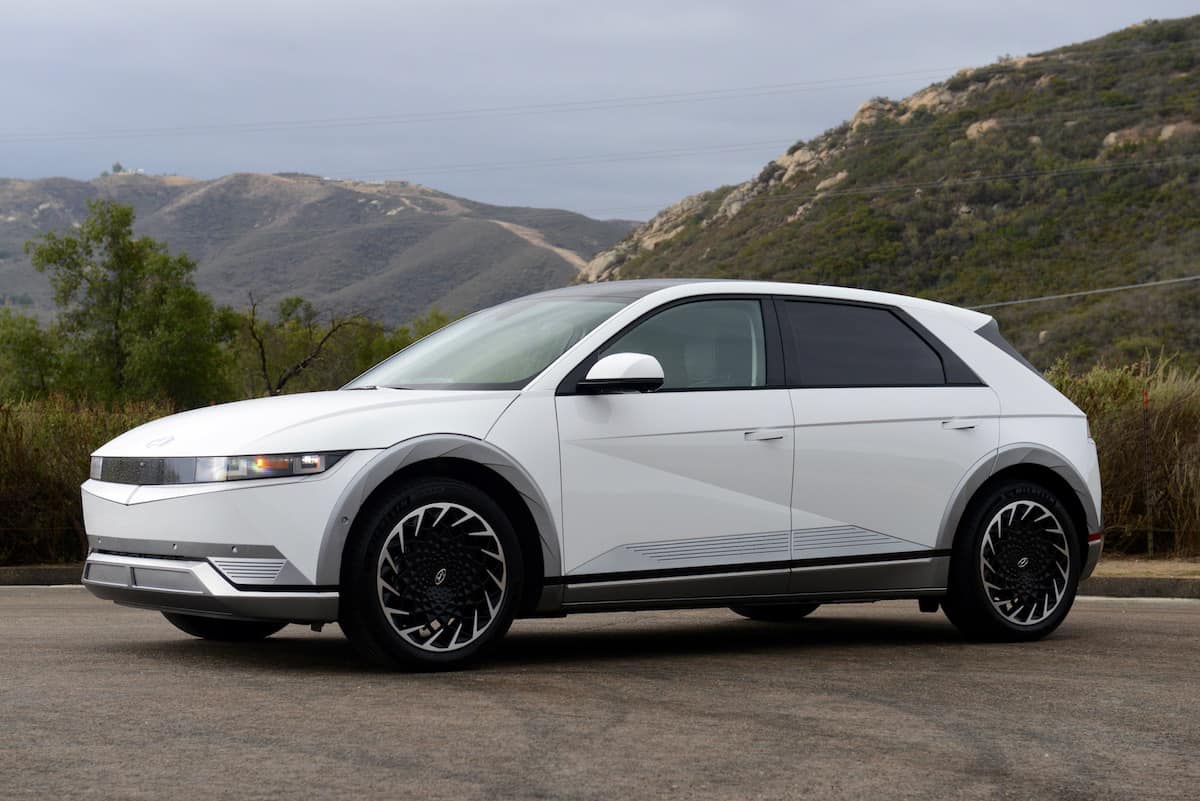 2022 Hyundai IONIQ 5 in white parked outside by the mountains