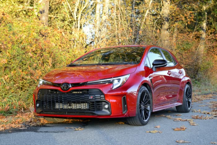 2023 Toyota GR Corolla Core front view parked on road with fall trees