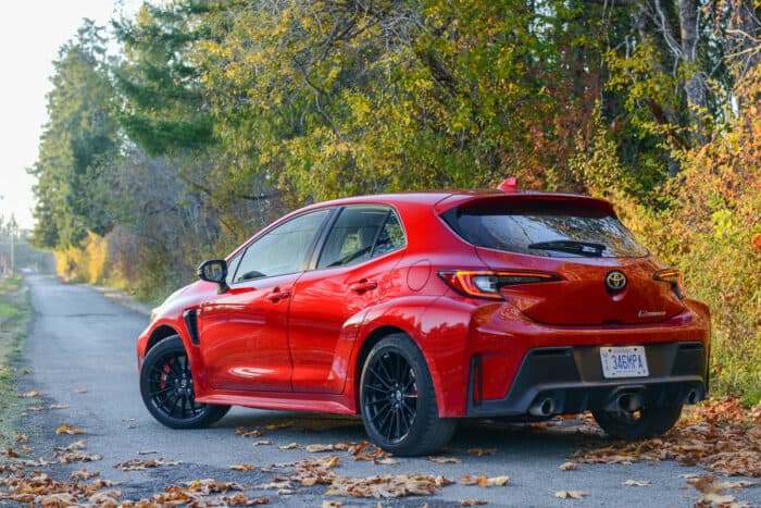 2023 Toyota GR Corolla Core rear shot parked on road with fall leaves