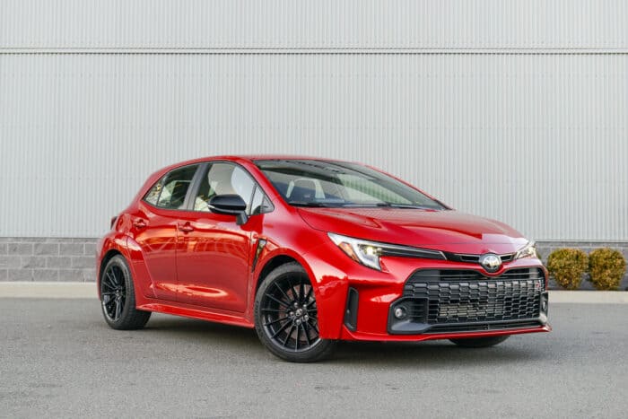 2023 Toyota GR Corolla Core in red front shot parked in front of building
