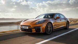 2024 Porsche Panamera Turbo E-Hybrid front view driving on the road