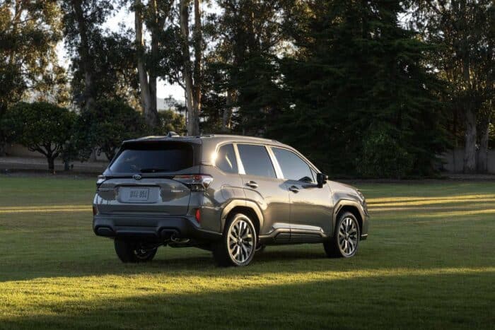 2025 Subaru Forester rear parked on grass at sunset