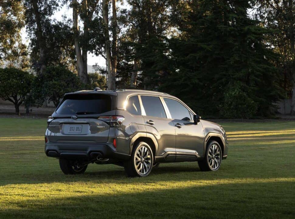 2025 Subaru Forester rear parked on grass at sunset