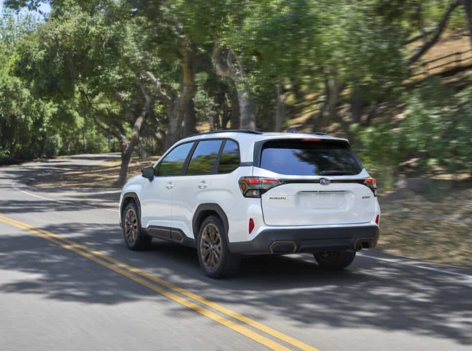 2025 Subaru Forester Sport white rear driving fast