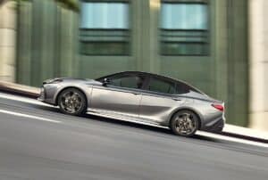 2025_Toyota-Camry_XSE driving fast up a hit on the road