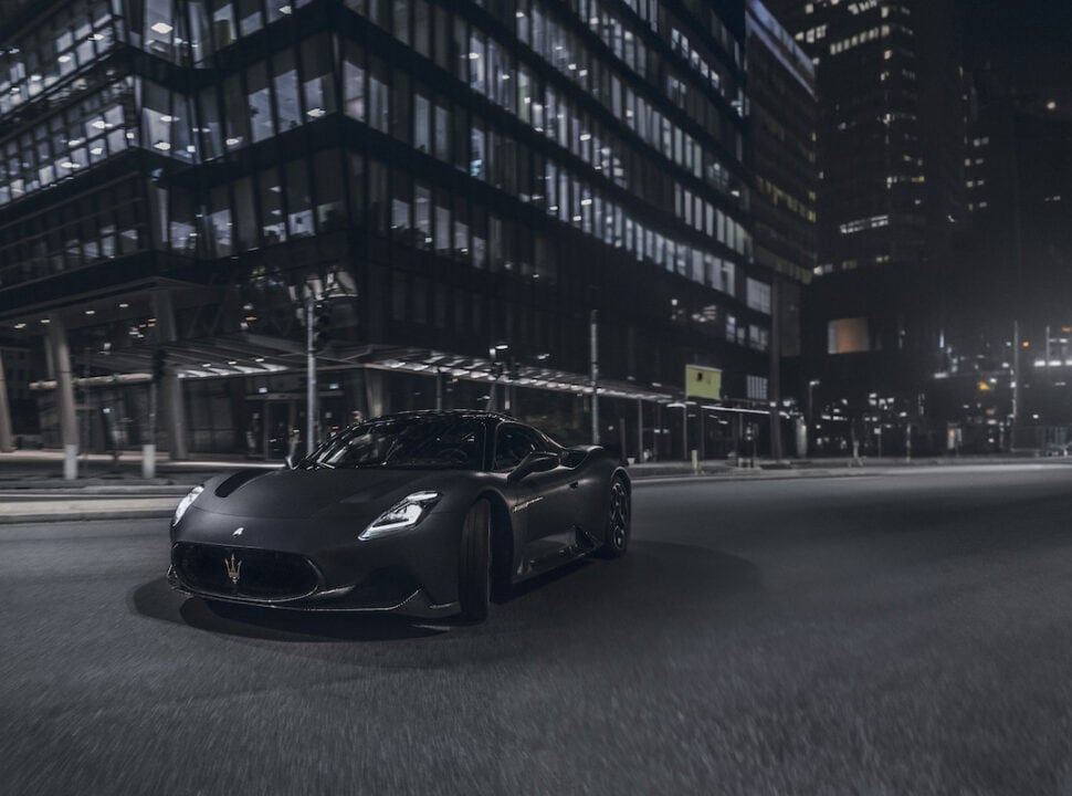 Maserati MC20 Notte Edition driving at night in the city