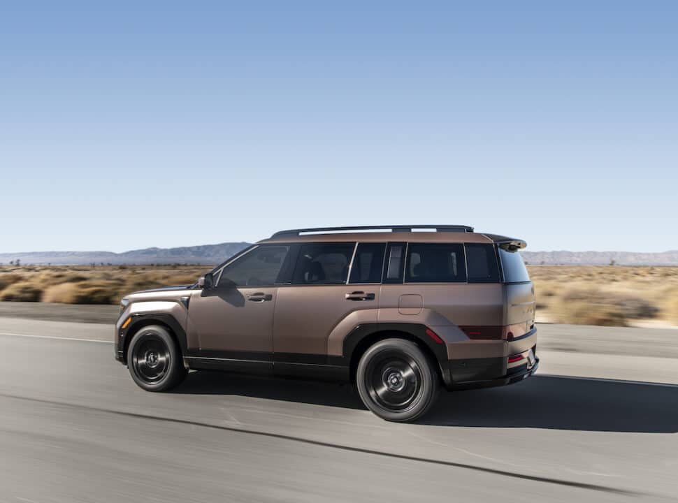 2024 Hyundai Santa Fe Calligraphy driving on the road rear shot