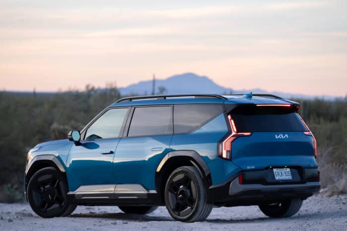 2024 Kia EV9 GT-Line rear view shot at sunset