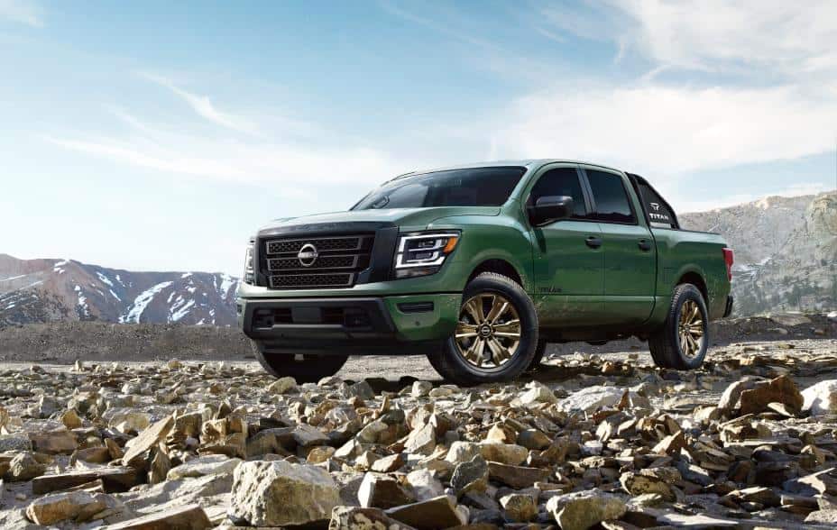 green 2024 Nissan TITAN parked on rocky road