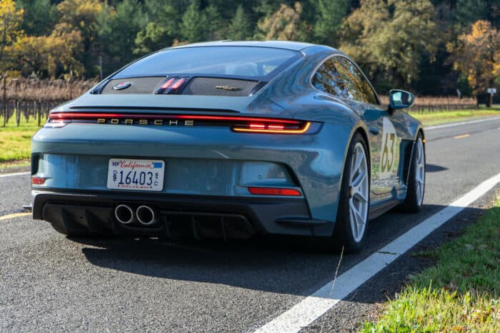 2024 Porsche 911 S/T rear shot parked on road with taillights on