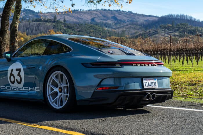 2024 Porsche 911 S/T rear end design parked on road by small mountains