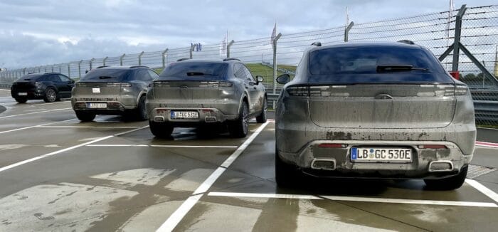 2024 Porsche Macan EV rear view of models in a row.