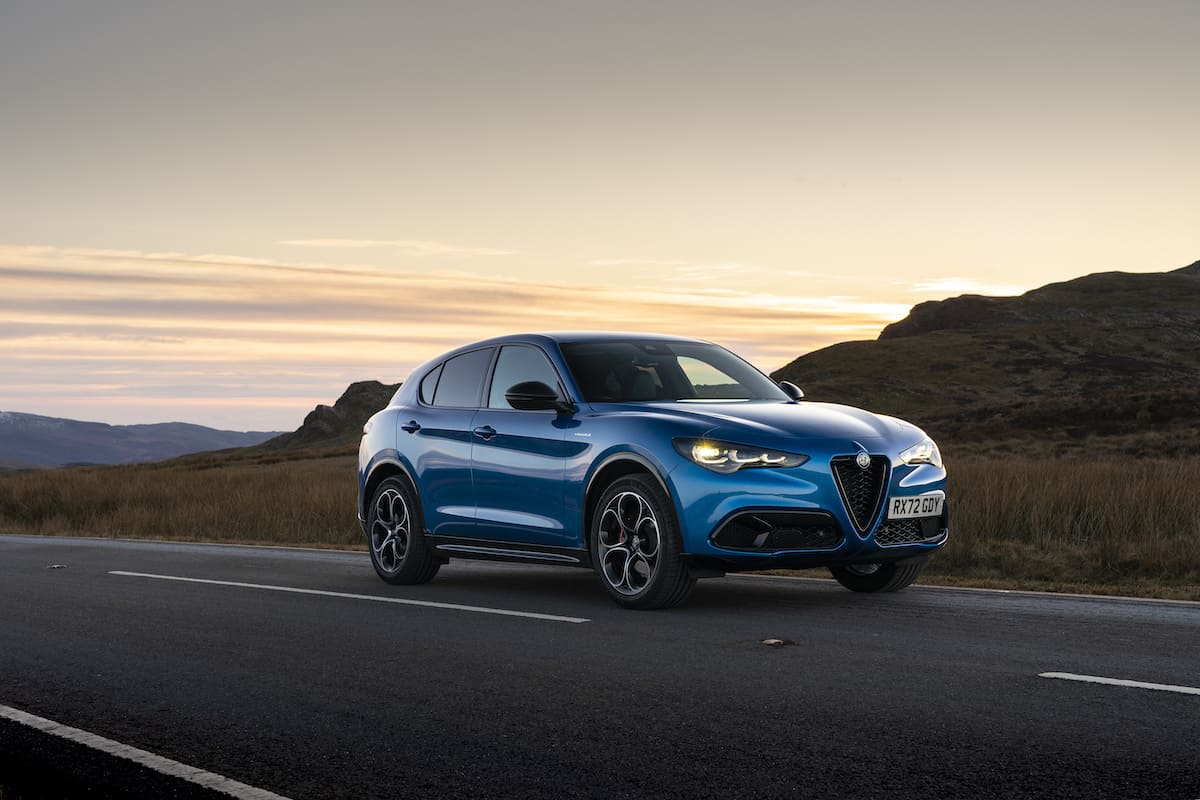 blue 2023 Alfa Romeo Stelvio Veloce at sunset