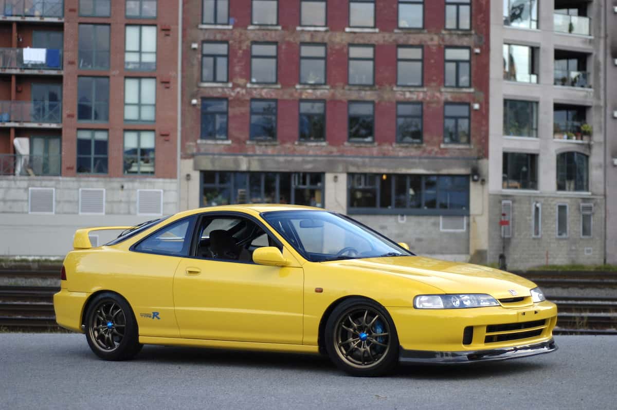 Yellow 1997 Honda Integra Type R front view parked on the street