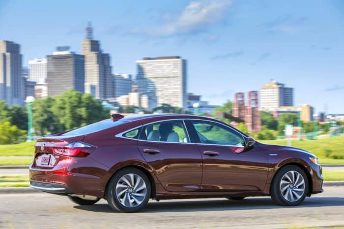 2019 Honda Insight Touring rear driving with city in the back