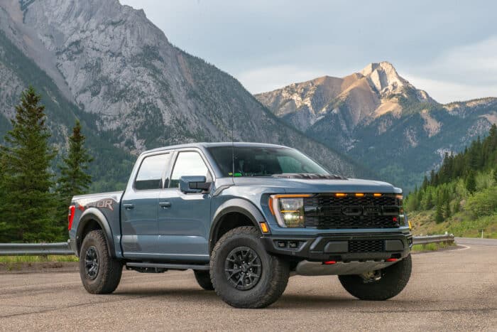 2023 Ford F-150 Raptor R front profile shot parked on roadside with mountains in the back