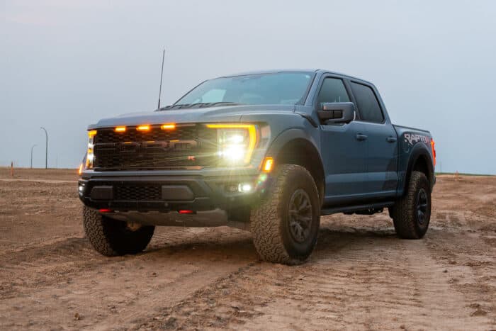 2023 Ford F-150 Raptor R front view parked on dirt at sunset