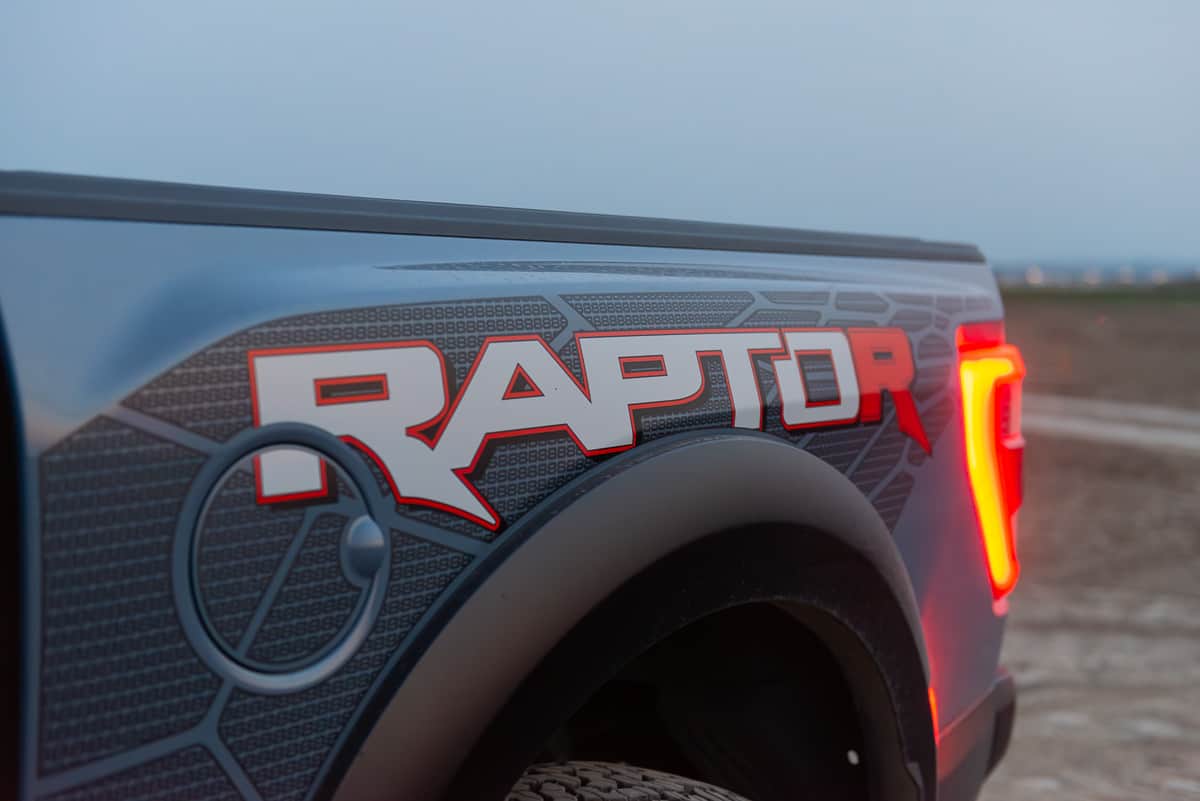 2023 Ford F-150 Raptor R logo at night with taillight on