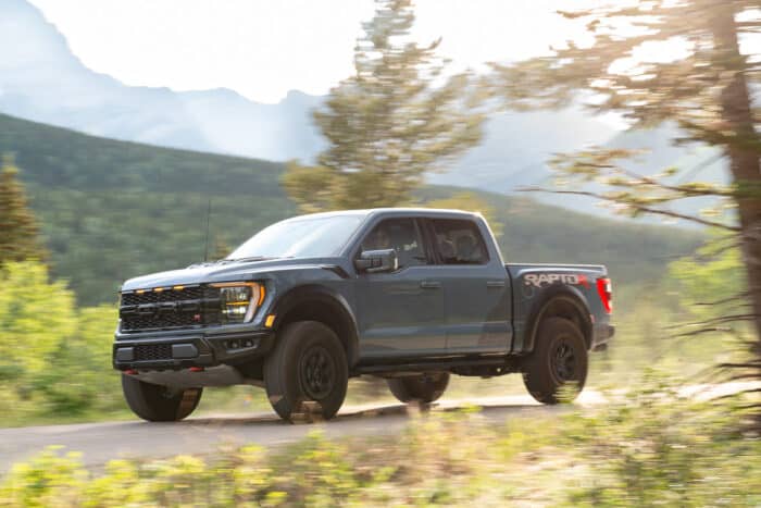 2023 Ford F-150 Raptor R driving fast in the mountains, front view