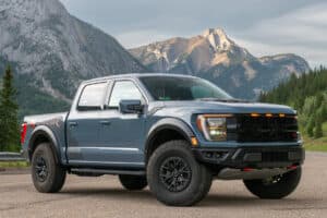 2023 Ford F-150 Raptor R front profile parked on road with mountains