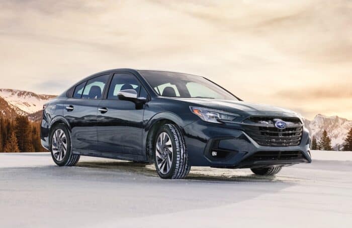blue 2024 Subaru Legacy in the snow front view