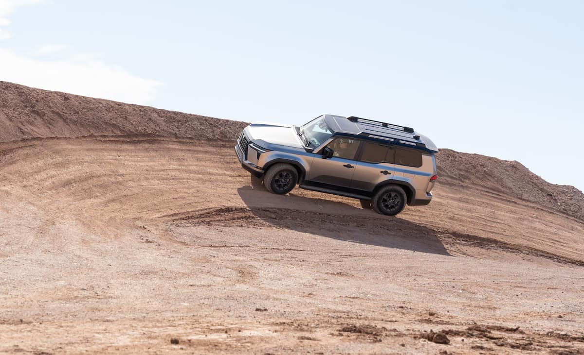 2024 Lexus GX 550 Overtrail driving around a bend on dirt