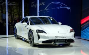 2025 Porsche Taycan front view on stage a global reveal