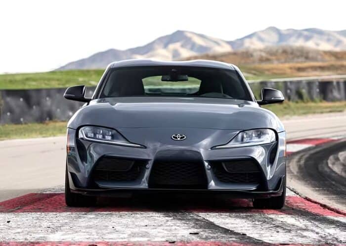 2023 Toyota Supra in Later Grey front view on the track