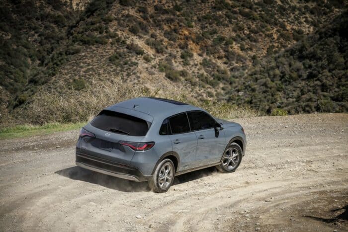 2024 Honda HR-V EX-L rear driving up dirt road