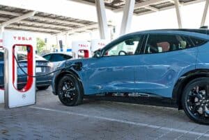 Ford Mach-E charging at Tesla Supercharger