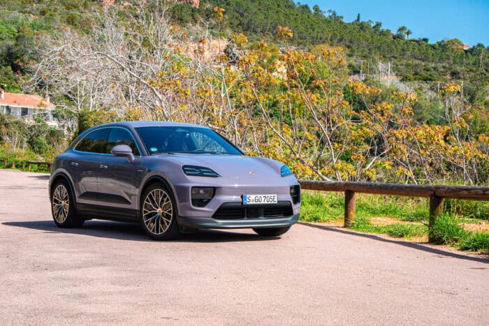 2024 Porsche Macan EV Turbo front view parked by trees